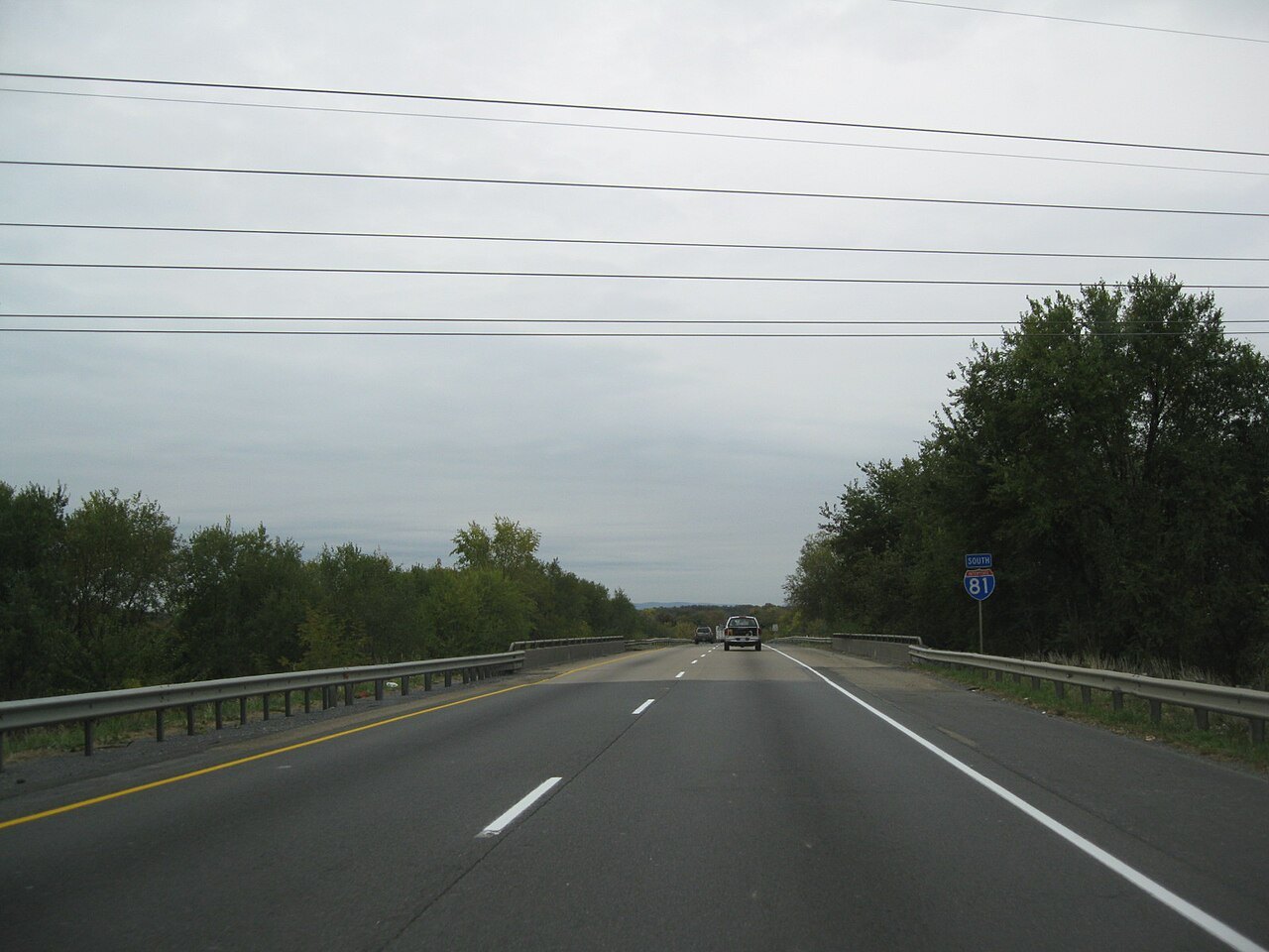 Interstate 81 South in Virginia, with the blue I-81 highway shield sign beside the road